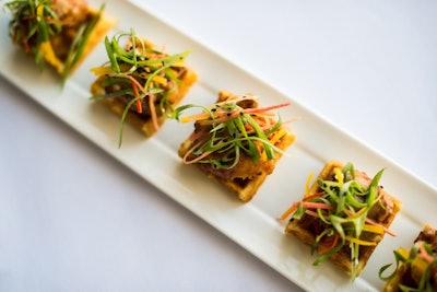 Buttermilk-fried chicken and waffle bites with black pepper gravy and scallions, by Oliver & Bonacini Events in Toronto