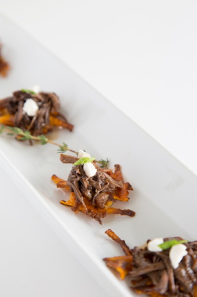 Seared sweet potato cakes topped with braised short ribs and horseradish liquid nitrogen pearls, by Chris Brugler Catering in Los Angeles
