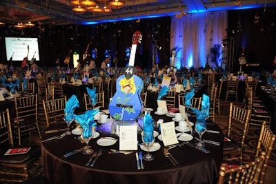 At the seventh annual Call of the Game dinner in March, held at South Florida's Seminole Hard Rock Hotel & Casino, painted guitars served as centerpieces. Oversize guitar picks displaying numbers let guests know at which table to sit.