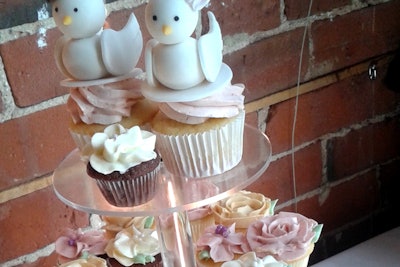 We can make rose piped cupcakes with custom cupcake toppers.