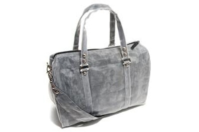 Duffle bag hand-stitched from repurposed netting in Cambodia