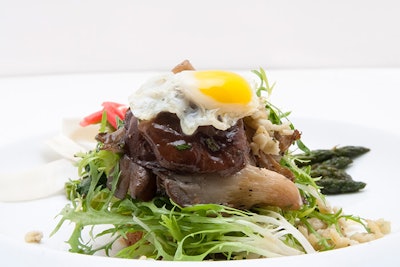 Warm chanterelle salad with crisp frisee, lamb belly lardons, fried quail egg, herb spaetzle, black truffle vinaigrette, and shaved burgundy truffles, by Michael Scott Events