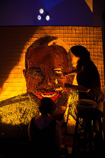 During the party, artists built a portrait of Kojo Nnamdi made entirely of food including cheese slices and chocolate.