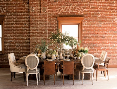 Table, chairs, and tabletop accessories, available in California, from Found Vintage Rentals; glassware and flatware, available in California, from Casa de Perrin. Florals: Inviting Occasion; Venue: The Loft on Pine in Long Beach, California