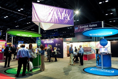 A colorful lounge in the middle of the show floor provides information about I.A.A.P.A. services, Internet access, meeting space, and the exhibitor service desk. The lounge also hosted a reception for first-time exhibitors Monday afternoon.