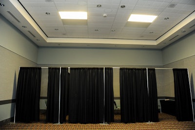 To provide a convenient, semi-private space for nursing mothers, organizers created four draped cubicles in one of the meeting rooms. Each space has a a table, a chair, and an electrical outlet.