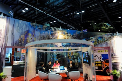 Attendees include more than 17,000 buyers from amusement parks, entertainment centers, casinos, zoos, and resorts. Enclosed meeting rooms, such as a glass-walled space in the Falcon’s Treehouse booth (pictured), facilitate deals.