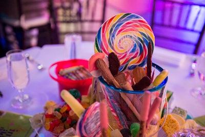 Centerpieces included sweet treats as well as crayons and markers that offered immediate entertainment.