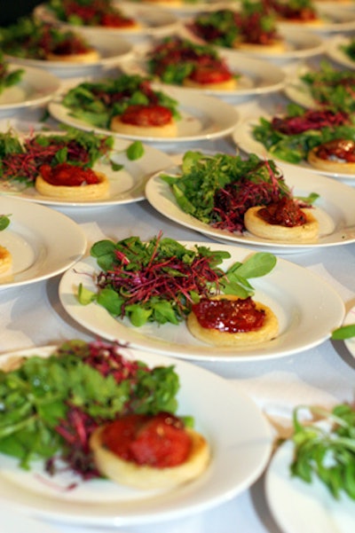 Lacquered tomato tarte tatin served with a salad of baby greens, beets, and carrots, by Marcey Browstein Catering and Events