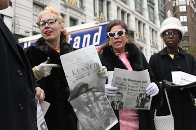 Brand ambassadors dressed in '60s-era garb buzzed excitedly about the big news and passed out promotional items to curious pedestrians. A total of 8,500 coins and 16,000 newspapers were handed out in Washington and New York City.