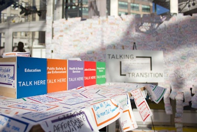 New Yorkers could also share their opinions in a more low-tech way by writing their thoughts on stickers color coded by topic and placing them up on plyboard walls and other surfaces around the tent.