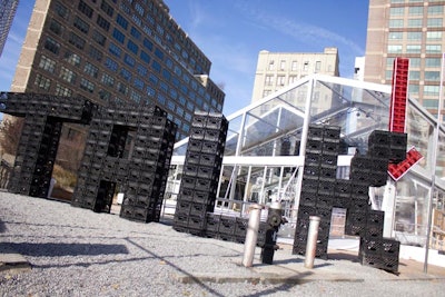 In order to grab the attention of those walking by, black milk crates were stacked outside to spell out the word 'talk.' Above the entrance, a giant red arrow pointed inside, where more black milk crates hanging from the ceiling spelled out the word 'here.'