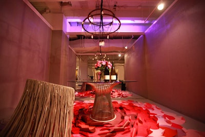 Knoll's table, designed by Gary Lee Partners, had a carpet of overlapping red shapes that resembled rose petals. The table's single chair was decorated with long, ghostly pieces of fringe.