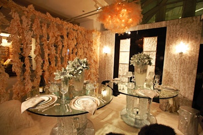 A chandelier made of bunches of baby's breath hung over the flowery setting at CS Interiors's table designed by Lalique Interiors with Natural Beauties Floral.