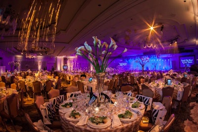 Event designer André Wells tailored the decor for Knock Out Abuse's gala to both the theme and attendees by using a soft, feminine color palette of gold, cream, pearl, blush, and ivory as well as sparkling elements via candles, crystal, and sequins.
