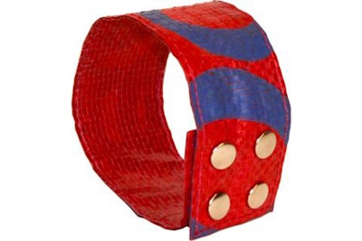 A funky, vibrant cuff handmade from recycled feed bag