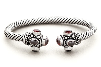 Striking cabled brass cuff edged with man-made garnet stones