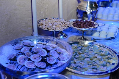 Catering company Neuman's Kitchen collaborated with chef Gabrielle Hamilton to create menus inspired by the year the trolley terminal opened. This included a stationary buffet during cocktail hour that offered Cherrystone clams, salted almonds, and stuffed celery.