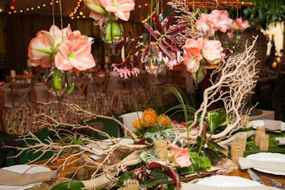 The table design from MB Custom Florals drew eyes upward with hanging vases.
