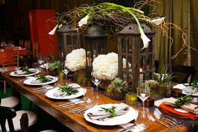Boca by Design used iron lanterns, calla lilies, and hydrangeas to create a rustic setting.