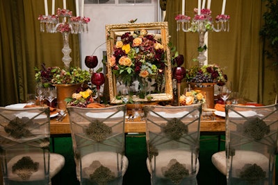 An empty picture frame cleverly highlighted a 3-D centerpiece from MB Custom Florals.