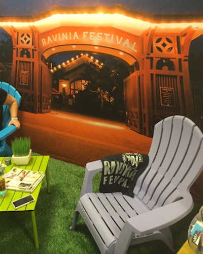 Ravinia advertised its grassy grounds with a booth that was, appropriately, grassy. Paved in Astroturf and holding two Adirondack chairs, the setup had a backdrop of the concert venue at night.