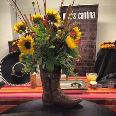 To underscore its Tex-Mex theme, Moe's Cantina spruced up its tasting station with flowers in a cowboy boot.