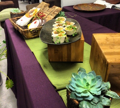 Fig Catering used succulents and blocks of wood to give its display an earthy look.