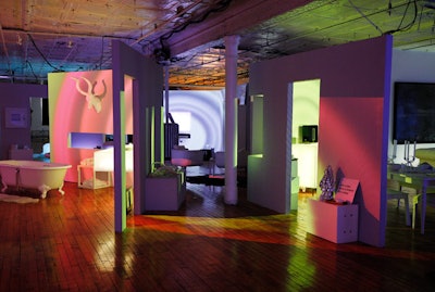 The installation consisted of four stylized, all-white rooms—a bathroom, a bedroom, a living room, and a dining room—each equipped with a tablet linked to the Play:1 app. Guests could pick a song to play, which the technology then analyzed based on elements such as beats per minute, pitch, and tonality to wash the room in a corresponding color and trigger ripple-like projections.