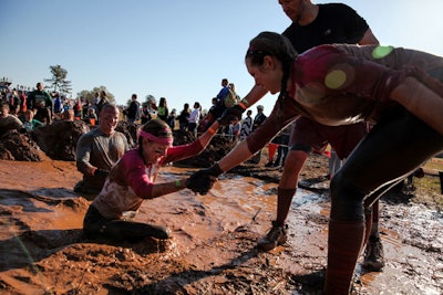By the end of the course, participants are usually covered in mud, making for distinctive photos at the finish line.