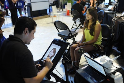The caricature has gone digital, with attendees posing to have their portraits created on tablets. It was a popular stop on part of the field level sponsored by the Lab Miami, and participants received a printout of the finished product.