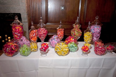 The 'Chocolate-Covered Candy Station' held large apothecary jars filled with treats from The Wrigley Company. Guests took home bags of chocolates, bubble gum, and Twix bars shaped like Santa Claus.