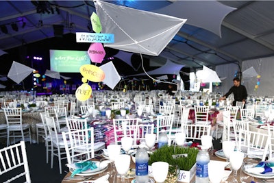 Russell Simmons’s Art for Life benefit, held in the Hamptons in July, featured an idyllic theme—“Field of Dreams”—that came to life in the whimsical centerpieces. Floating kites suspended over each table and anchored to wheatgrass flats had colorful signs on their tails that held the names of artistic vocations such as “dancer” and “poet.”