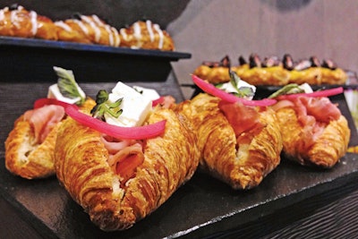 Prosciutto with pickled red onion and feta cheese in a croissant, by the Revere Hotel in Boston