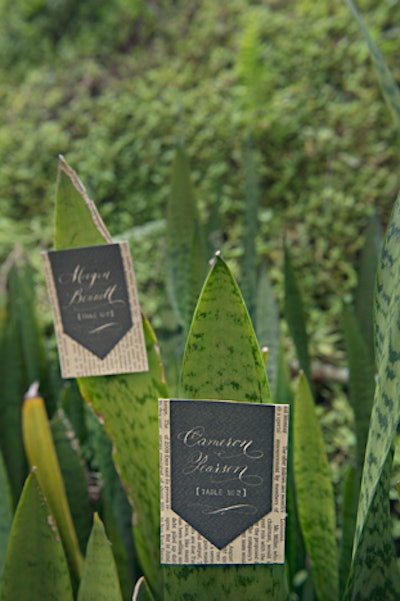 For a shoot staged in a Costa Rican rainforest, black pieces of paper backed with newsprint were decorated with guests' names in white calligraphy and hung from plant leaves. 'Newsprint became a huge source of inspiration for us. The simplicity of black and white, mixed with clean typography, found its way into almost every design element,' writes Coppola. 'Introduce unique and unexpected elements into your design. Be creative. Take the ordinary and make it extraordinary.'