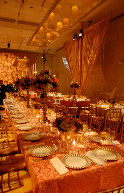 Electronic candles were suspended above the head table on glass shelves to complement the soft gold and yellow up-lights throughout the ballroom.