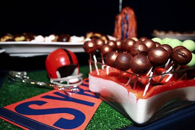 At The Express premiere, the night’s dessert offerings included truffle pops displayed in glass containers holding layered sugar that was coordinated with Syracuse University’s team colors.