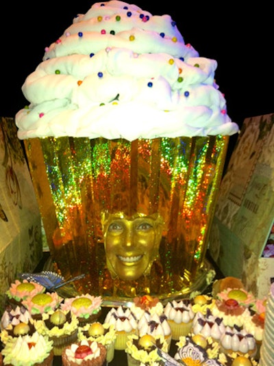 Interactive buffet heads from Day Entertainment & Events include a glittery, grinning human cupcake.