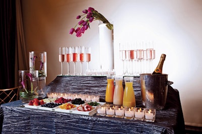 Make-your-own champagne cocktail bar with orange and pineapple juices, Angostura bitters, sugar cubes, lemon twists, fresh fruit, and champagne, by the Mandarin Oriental in San Francisco
