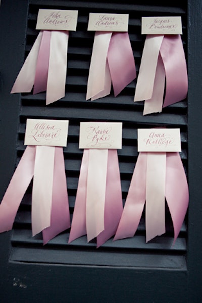 The authors encourage readers to look at their surroundings and integrate unexpected elements into the event's design. Case in point: Escort cards were attached with varying shades of ribbon to hurricane shutters for a shoot in the French Quarter of New Orleans.