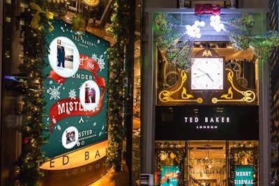 Ted Baker is encouraging shoppers to snap selfies under the huge aluminum mistletoe sculpture hanging above the entrance of its Fifth Avenue store. Images shared on Twitter and Instagram with the hashtag #KissTed appear on screens inside the store windows.
