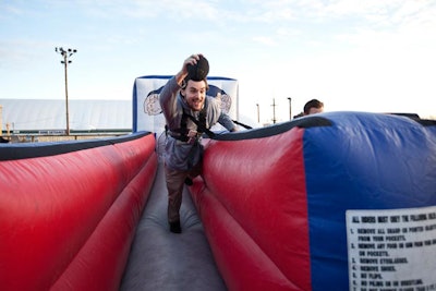 Outside of the N.F.L. Super Bowl XLVI party in Toronto, guests showed off their gridiron skills at inflatable game stations, where people could kick a field goal, throw a pass, or race their friends.