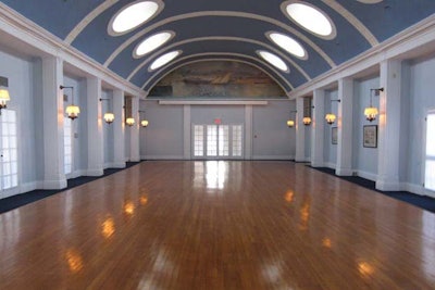 Main ballroom with high ceilings, vaulted windows