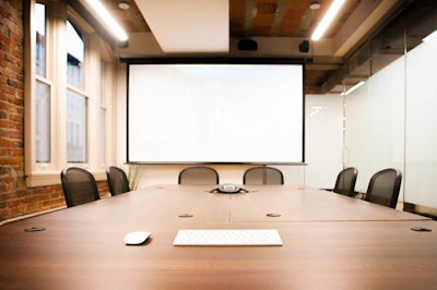 Conference table with projection screen