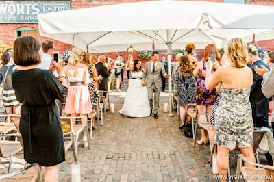 Lovely summer outdoor ceremony with patio umbrellas