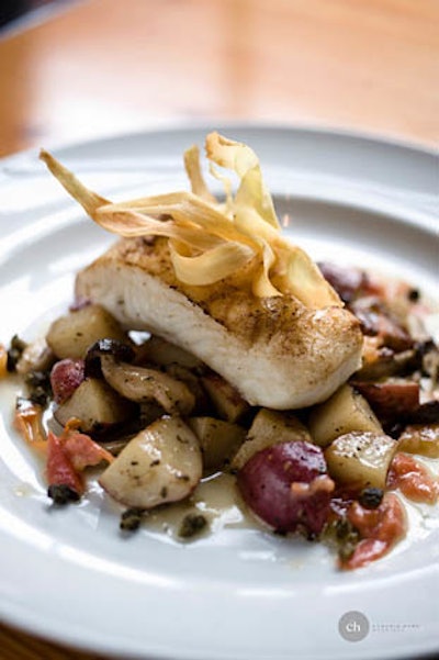 Halibut filet with roasted potatoes, wild mushrooms, and bacon