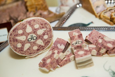 A charcuterie spread came in a pretty pattern with the initials of chef Daniel Boulud, who hosted an opening-night reception at his Cafe Boulud.