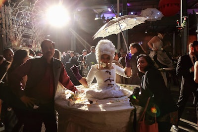 In what would be typical only at a Redmoon event, a performer dressed as Marie Antoinette circulated with a dessert table strapped around her waist. The tablecloth—also part of her dress—was strewn with rose petals.