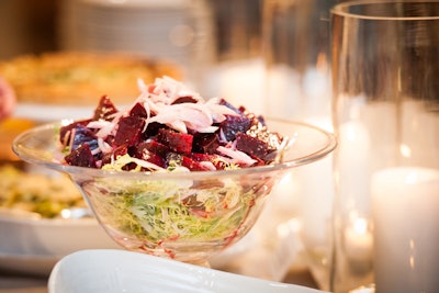 Susan Gage served a beet and blood orange side salad in large clear standing bowls on each buffet table.