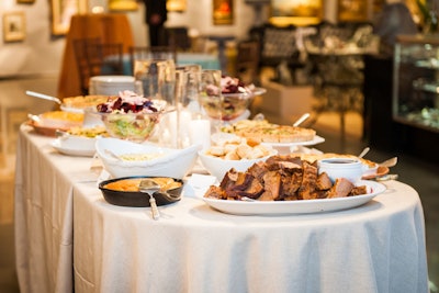 Buffet tables were set up throughout the three floors of venue with Southern fare such as cheddar cheese grits, barbecue beef brisket, and cornbread served in iron skillets.